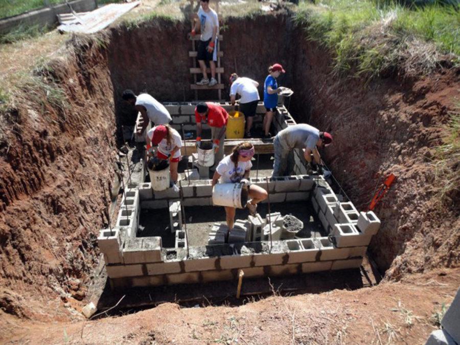 ISU students construct a septic tank by hand in Belize for a study abroad program during spring break 2012, demonstrating the benefit hard work has to the community.
