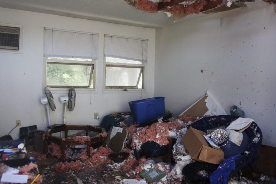 Tenants of 301 S. Fifth St., one of the South Meadow apartment buildings, move their belongs out of the water and fire damaged apartments on Monday, July 16, the day following a fire that caused significant damage to the building. 
