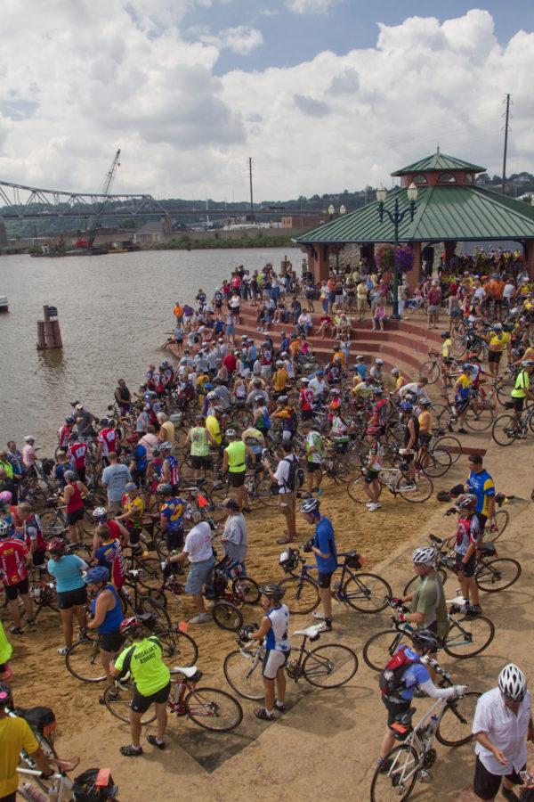 Bikers dip their front tires in the Mississippi River on Saturday as per RAGBRAI tradition in Dubuque.  