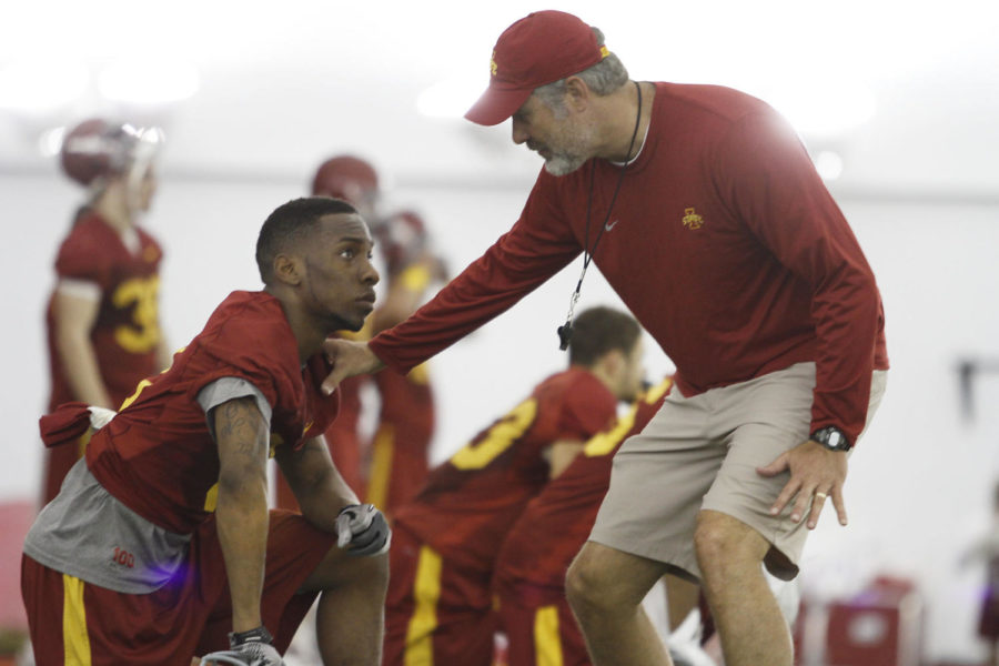 Coach+Paul+Rhoads+talks+with+defensive+back+Cliff+Stokes+during+football+practice+on+Tuesday%2C+March+20%2C+at+the+Bergstorm+Indoor+Practice+Facility.+This+is+Stokes+first+year+at+Iowa+State.%0A