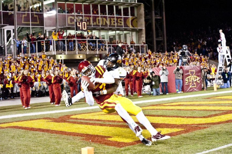 Wide receiver Darius Reynolds receives a touchdown pass during the game against Oklahoma State, Nov. 18. Reynolds made four receptions for 39 yards in the game.
