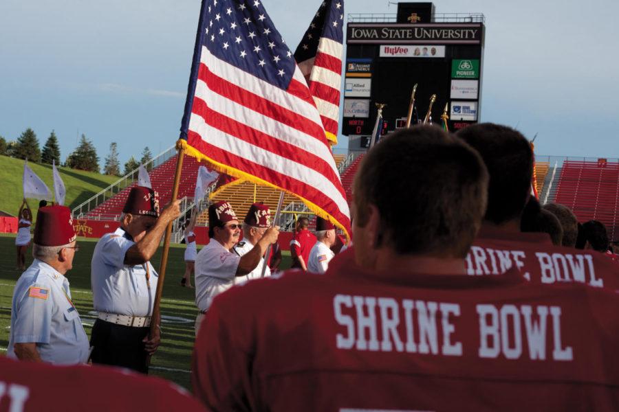 Shriners present the colors during the opening events of the Shrine Bowl Saturday at Jack Trice Stadium. 