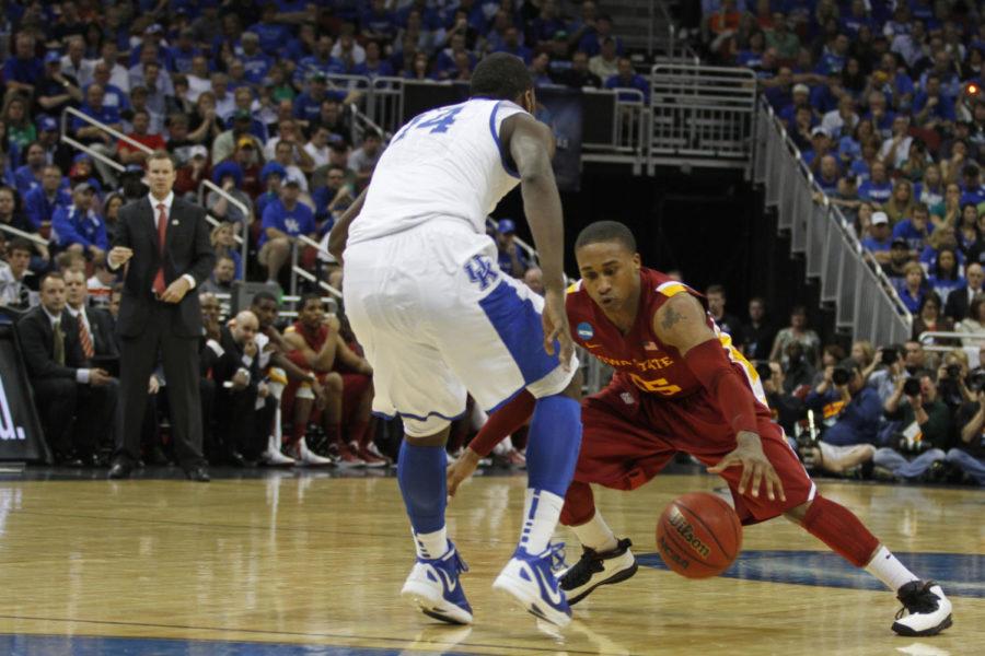ISU guard Tyrus McGee scrambles to grab a loose ball during the first half of Iowa States game with No. 1 and overall top-seeded Kentucky in the third round of the NCAA tournament in Louisville, Ky., on Saturday, March 17. McGee was held scoreless in 14 minutes off of the ISU bench.
