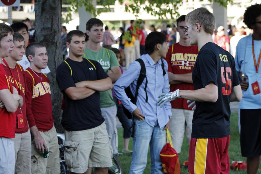 Christopher Weber, junior in kinesiology and health, talks to students on how the game of Quidditch is played Thursday, Aug. 16, during the opening picnic for Destination Iowa State at Iowa State Center. Destination Iowa State is a program intended to help new students transition into the college life.
