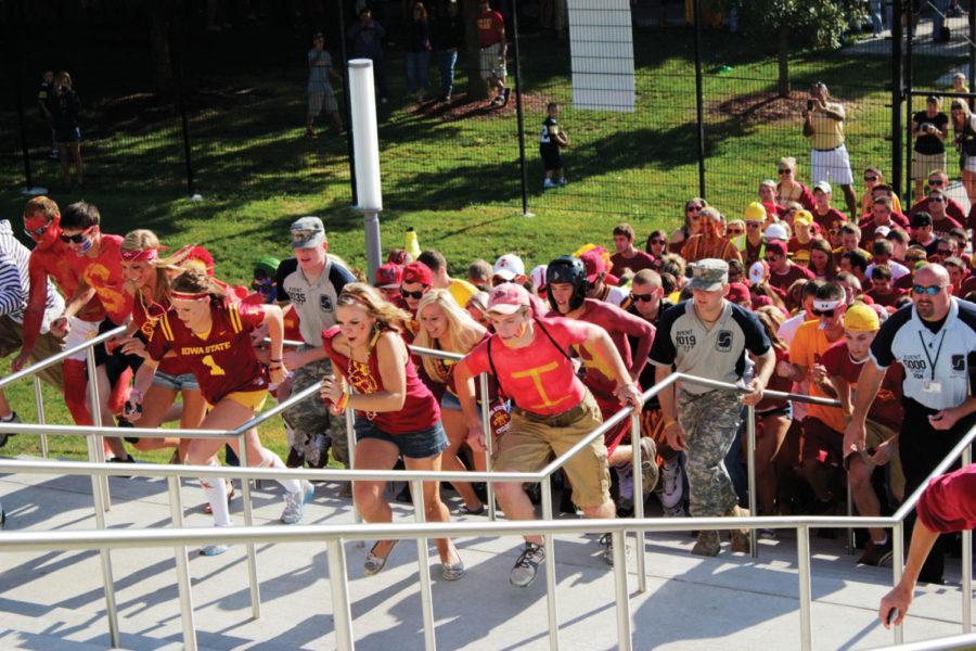 Students sprint up the stairs to Jack Trice Stadium on the
morning of Saturday, Sept. 10. Diehard fans lined up as early as
Friday morning, hoping to score front-row seats for the game
against Iowa.
