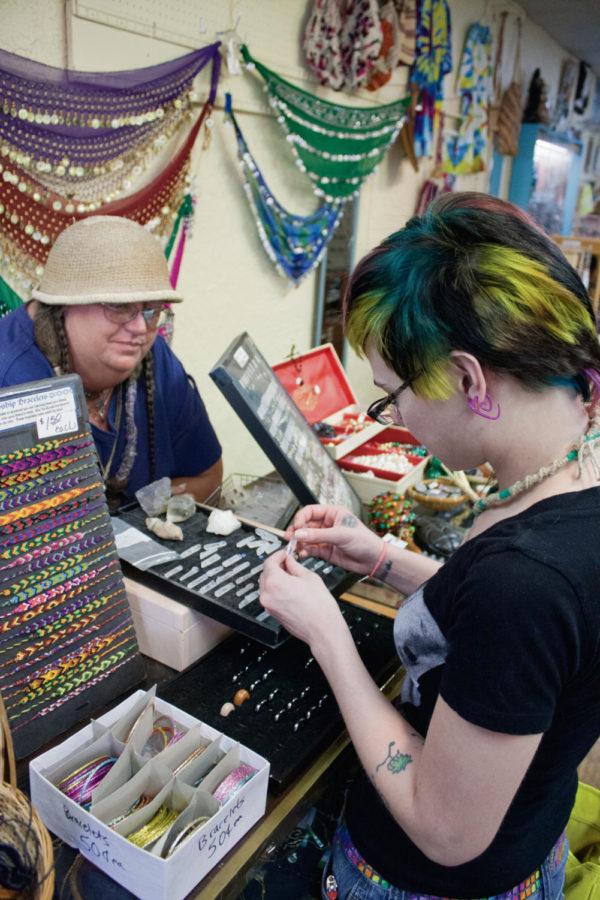 Meranda Anthofer, an Ames resident, looks at crystals at Grandmas Attic Thursday, Aug. 23 in Campustown. Christy Radach, the owner and sole proprietor, has been in business since 2005.
