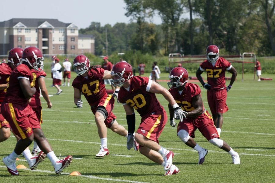 Linebackers A.J. Klein, No. 47, Jeremiah George, No. 52, and Jake Knott , No. 20, run a drill during the ISU football teams first fall practice of the 2012 season, Friday, Aug. 3, in Ames. The team is preparing for its season opener Sept. 1 when the Cyclones host Tulsa.
