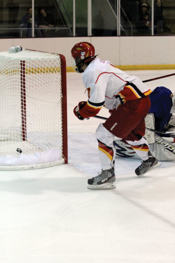 ISU forward Trevor Lloyd scores against Kansas on Friday, Sept. 28, at the Ames/ISU Ice Arena. Cyclones won 9-1.
