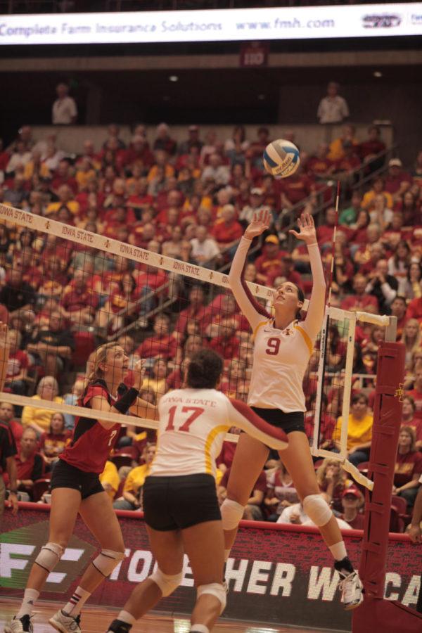 Alison Landwehr jumps to hit the ball during the game against Nebraska on Saturday, Sept. 15, at Hilton Coliseum. Cyclones won 3-1, which is the first time Cyclone volleyball team has defeated a No. 1 team in school history. 
