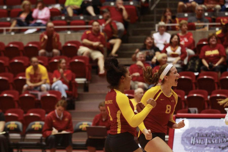 Freshmen Jenelle Hudson and Andie Malloy celebrate a point during a game against Eastern Washingtion Eagles Friday afternoon. The game was part of the 2012 Iowa State Challenge Tournament at Hilton Coliseum.
