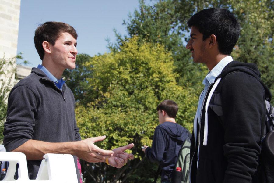 Jake Swanson,GSB senator for the College of Agriculture, talks with Deepak Premkumar, junior in economic and global resource systems about the Government of the Student Body on Wednesday in front of Parks Library.
