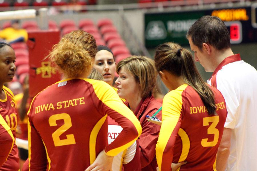 Head coach Christy Johnson-Lynch talks to the Cardinal team during a timeout in the intrasquad scrimmage Saturday, Aug. 18, at Hilton Coliseum. The Cardinal team won all four sets that were played. The Cyclones open the 2012 season against Cincinnati on Friday, Aug. 24, in Knoxville, Tenn.
