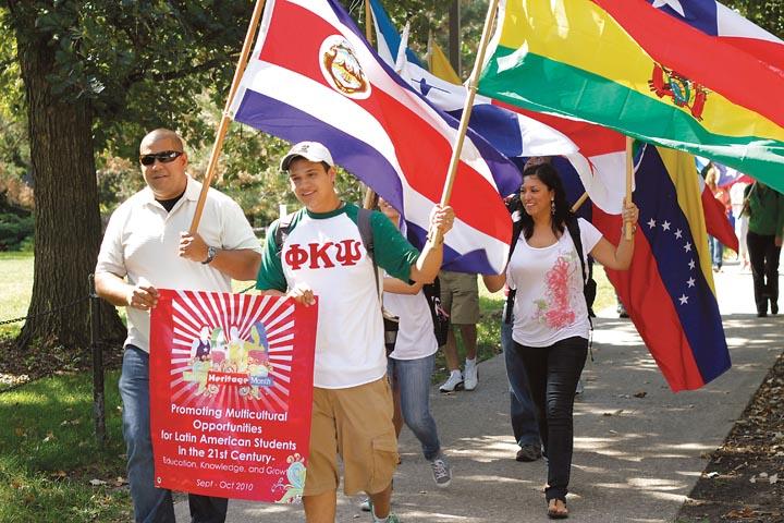 Brian Castro, senior in civil engineering, participates in Marcha de las Banderas, or March of the Flags, in celebration of Latino Heritage Month on Wednesday, Sept. 15.