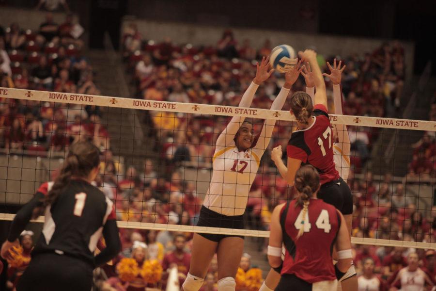 Tenisha Matlock blocks the ball during the game against Nebraska on Saturday, Sept. 15, at Hilton Coliseum. Cyclones won 3-1, which is the first time Cyclone volleyball team has defeated a No. 1 team in school history. 
