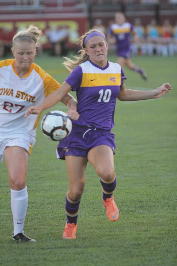 Theresa Kucera attempts to kick the ball against UNI forward Annie Dale during the game Tuesday, Sept. 4, at the ISU Soccer Complex.
