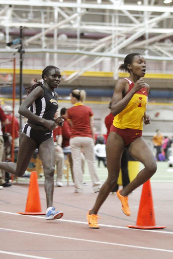 Aliphine Tuliamuk (left) and Betsy Saina race the final lap during the womens 5,000-meter run during the indoor season. 
