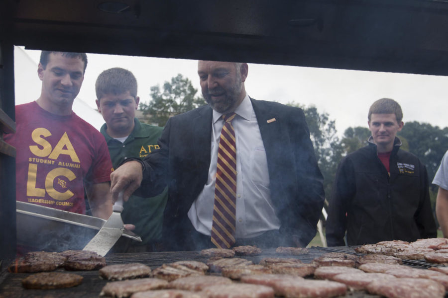 President Steven Leath helps students cook hamburgers during the celebration of his installation Thursday, Sept. 13, on Central Campus. The installation ceremony will be at 10 a.m. Friday in Stephens Auditorium. 

