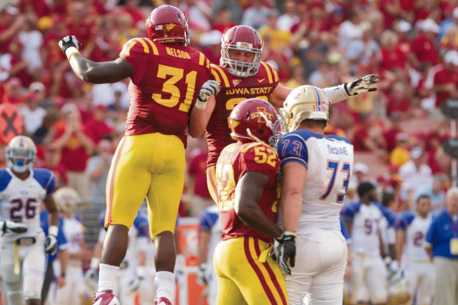 Defensive+end+Rony+Nelson+and+linebacker+Jake+Knott+celebrate+on+the+field+in+the+season+opener+against+Tulsa.+Iowa+State+defeated+Tulsa+38-23+Saturday%2C+Sept.+1%2C+at+Jack+Trice+Stadium.%0A
