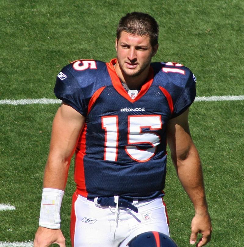 Former Denver Broncos quarterback Tim Tebow walks across the field after practice on Sept. 26, 2010. 
