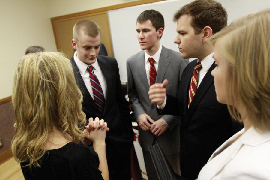 Presidential candidates of the Government Student Body Jake Swanson and Jared Knight and their respective running mates David Bartholomew and Katie Brown talk after the debate on Tuesday, Feb 28 at 3245 room of the Memorial Union. The selection will be on March 5 and 6. 
