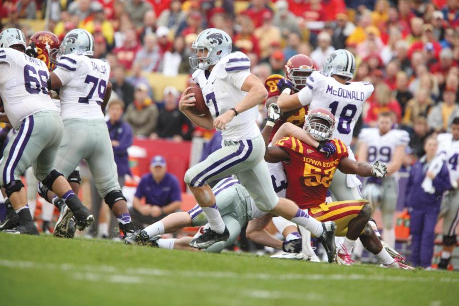 KSU quarterback Collin Klein scrambles past ISU linebacker Jeremiah George for a quick gain in Iowa States 27-21 loss to Kansas State on Oct. 13, 2012. Klein rushed for 105 yards and two touchdowns in the Wildcats fifth straight win against the Cyclones.
