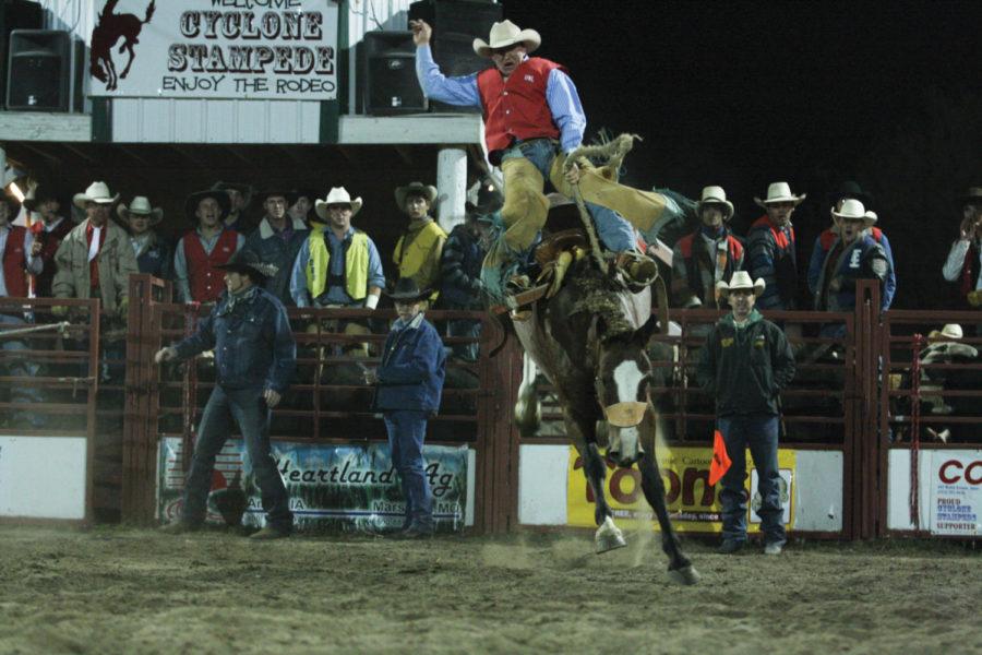 Caleb Miles of the University of Nebraska-Lincoln rides in the
saddle bronc-riding competition during the 49th Annual Cyclone
Stampede Rodeo on Friday, Sept. 30, in Ames. Saddle bronc riding
requires the rider to stay on the horse with a specific technique
for at least eight seconds.

