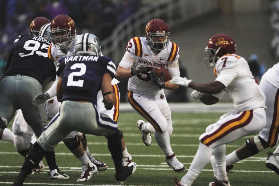 ISU running back Jeff Woody breaks through the ISU offensive line during the Cyclones 30-23 loss to No. 11 Kansas State on Saturday, Dec. 3. Woody led the Cyclones with career highs in carries (23), yards (85) and touchdowns (two) in the loss.
