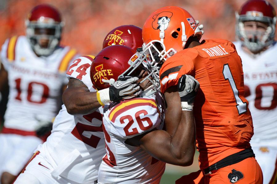 Deon Broomfield tackles OSU running back Joseph Randle in the Cyclones' 31-10 loss to Oklahoma State on Saturday, Oct. 20, at Boone Pickens Stadium.
