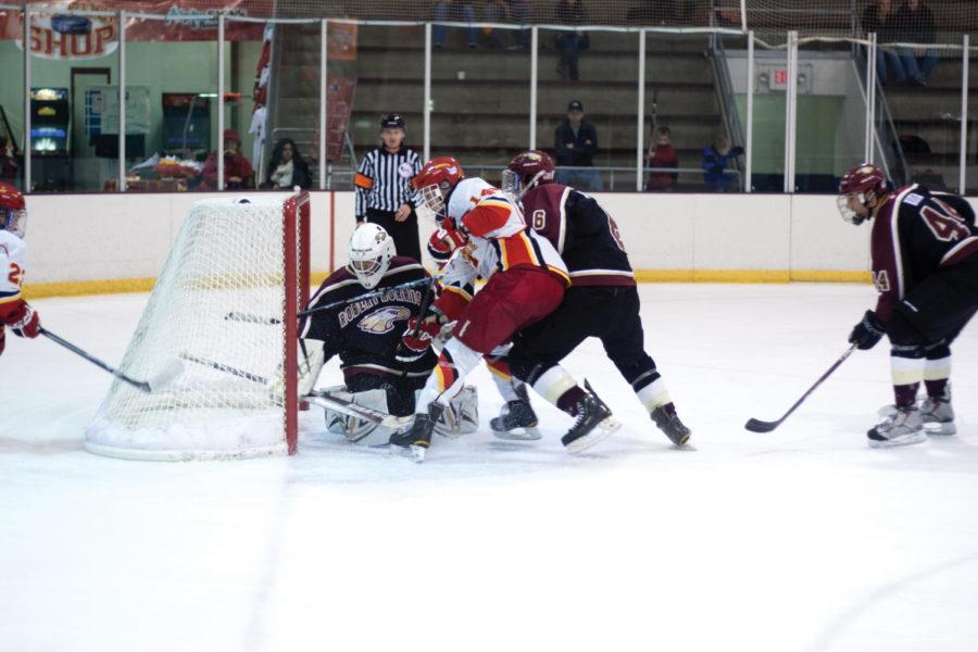 ISU forward James Buttermore scores a goal against the Robert Morris Eagles during the third period Friday, Oct. 19, at the Ames/ISU Ice Arena.
