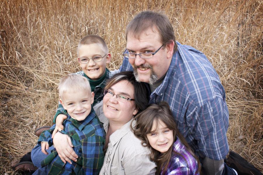 
Rachel Johnson, a 37-year-old senior in history, with her family. Johnson, who is Deaf, believes herself to be culturally Deaf, as opposed to deaf with a lower-case d. Members of the deaf community find this distinction to be highly important.


