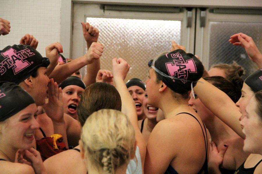 The Cyclone swimming and diving team celebrates after defeating South Dakota during the double dual meet Friday, Oct. 26, at Beyer Hall. Despite beating South Dakota 246-53, Iowa State fell to Nebraska 176.5-122.5.
