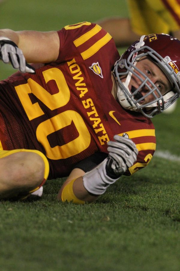 Linebacker Jake Knott rolls over on his recently injured left shoulder after tackling a player during the Homecoming game against Baylor on Saturday, Oct. 27, at Jack Trice Stadium. Cyclones were victorious in a 35-21 game.
