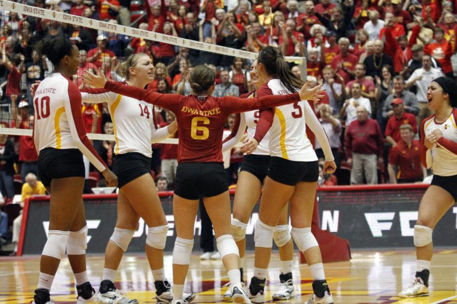 The ISU volleyball team celebrates the victory over the Kansas Jayhawks on Wednesday, Oct. 24, at Hilton Coliseum. The Cyclones won the match 3-1.
