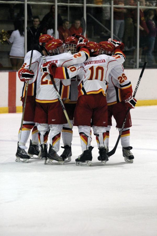 Cyclones celebrate after scoring against Kansas on Friday, Sept. 28, at Ames/ISU Ice Arena. Cyclones won 9-1.
