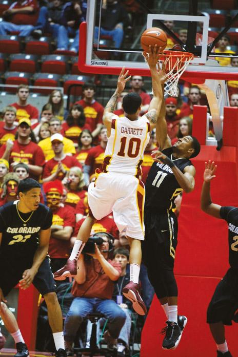 Guard Diante Garrett drives in for a layup against Colorados Cory Higgins during the Iowa State - Colorado game held Wednesday, March 2 at Hilton Coliseum. Diante Garrett had 16 points for the night. 