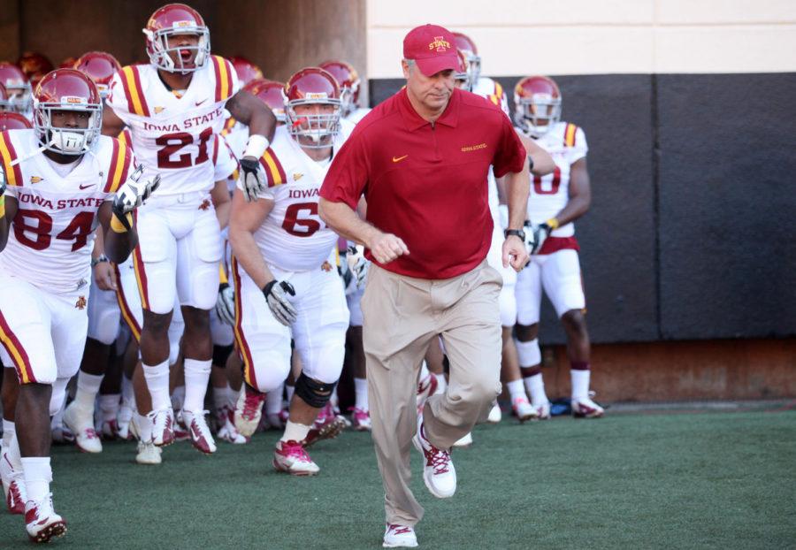 ISU head coach Paul Rhoads leads his players onto the field on Saturday, Oct. 20, at Boone Pickens Stadium. The Cyclones faced by the OSU Cowboys.
