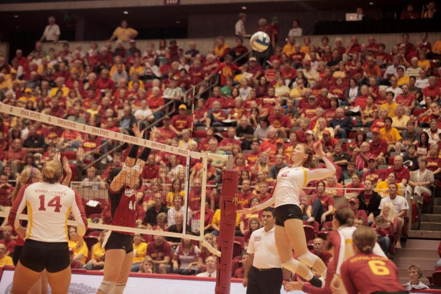 Freshman Mackenzie Bigbee jumps to hit the ball during the game against Nebraska on Saturday, Sept. 15, at Hilton Coliseum. Cyclones won 3-1, which is the first time Cyclone volleyball team has defeated a No. 1 team in school history. 
