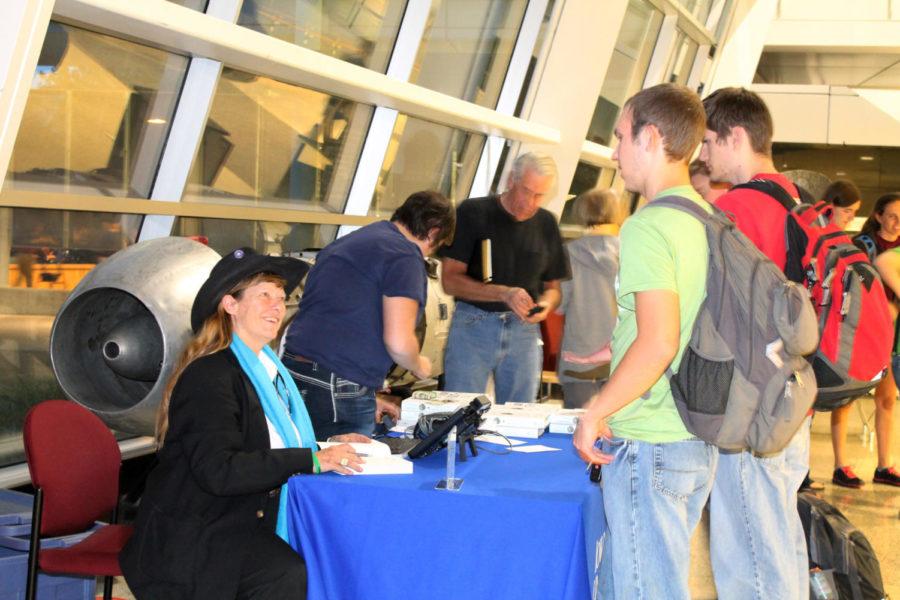 Hunter Lovins signs copies of her books after a lecture about how citizens need to prepare themselves for a change in personal sustainability. Lovins lecture, Is Capitalism the Key to Global Sustainability?, was Wednesday, Oct. 3 at the Alliant Energy-Lee Liu Auditorium in Howe Hall.
