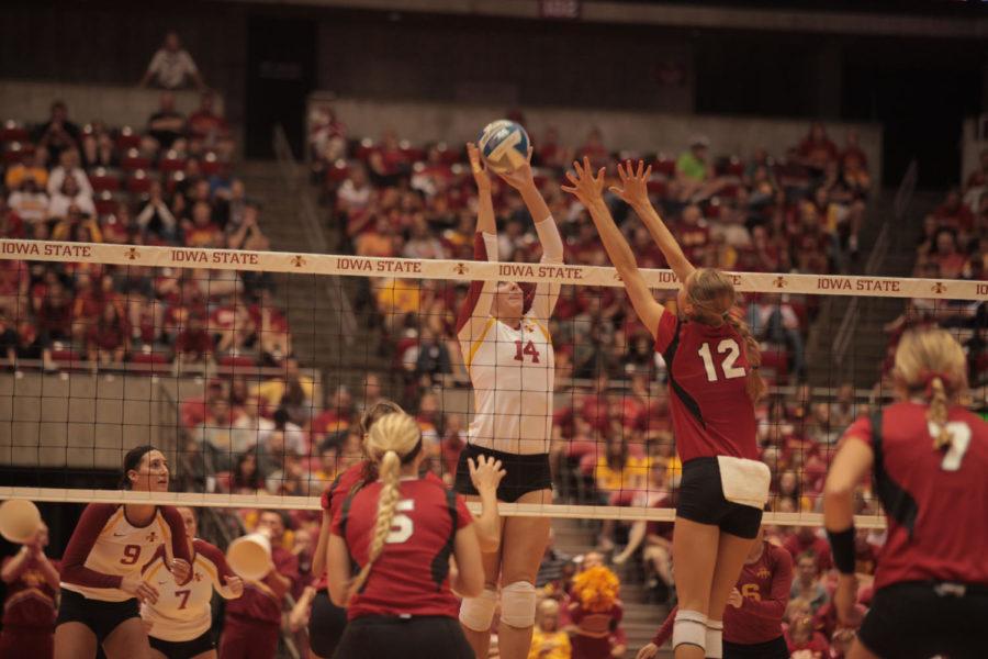 Jamie Straube hits the ball during the game against Nebraska on Saturday, Sept. 15, at Hilton Coliseum. Cyclones won 3-1, which is the first time Cyclone volleyball team has defeated a No. 1 team in school history. 
