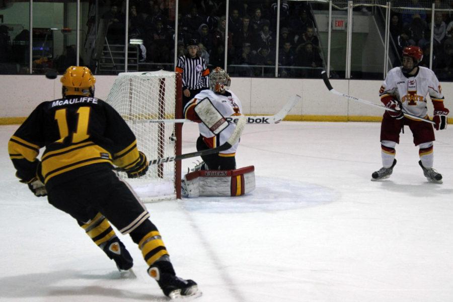 The puck soars after deflecting off of Scott Ismonds blocker to make a save in a game between the Iowa State and Arizona State on Saturday, Oct. 6, at the Ames/ISU Ice Arena. The Sun Devils beat the Cyclones 2-1, completing a sweep of a two-game series the two teams played over the weekend.
