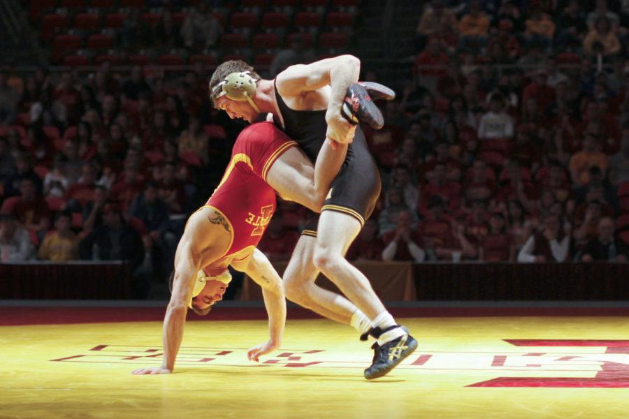 Iowas Derek St. John attempts to take down Iowa States Michael
Moreno during Sundays Cy-Hawk meet held Sunday afternoon at Hilton
Coliseum. St. John defeated Moreno via pin to help the Hawkeye team
defeat the Cyclones 9-27.

