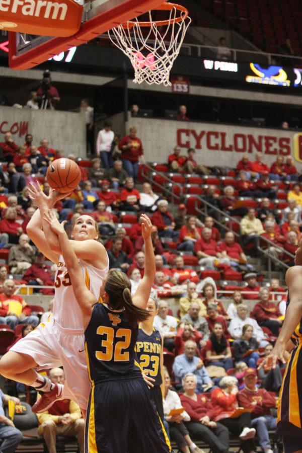 Senior forward Chelsea Poppens goes up for a shot against William Penn forward Taylor Reed at Hilton Colliseum on Tuesday, Nov. 6. The Cyclones defeated the Statesmen 98-55.
