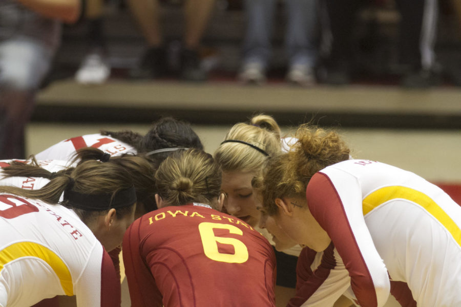 The ISU volleyball team members get down for a cheer during the third set. Iowa State won 3-0 against TCU on Saturday, Sept. 29, at Hilton Coliseum. 
