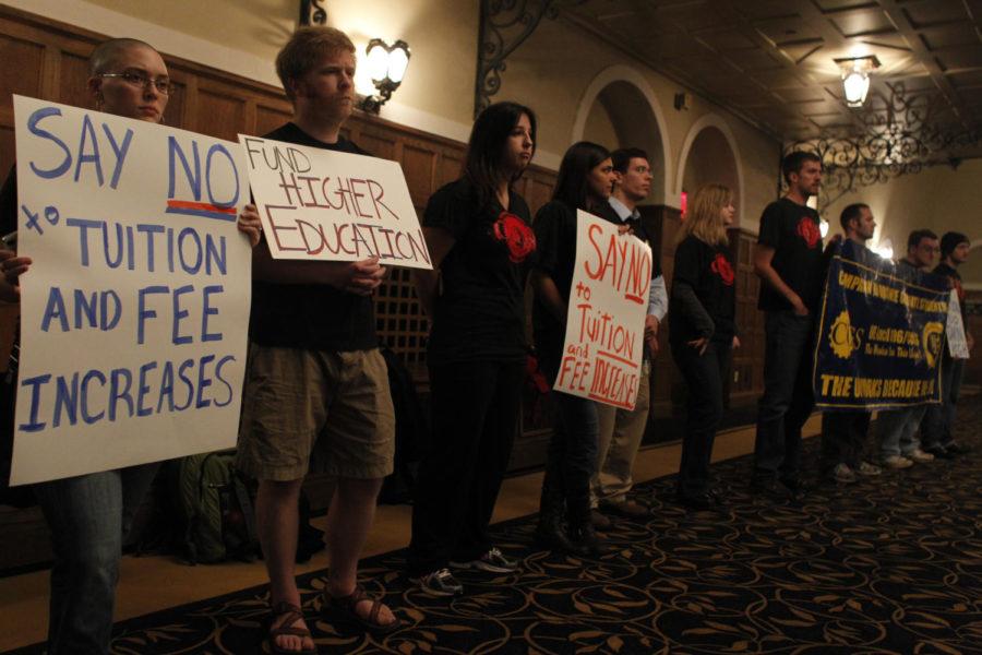 University of Iowa graduate students protest tuition and fee increases at the state Board of Regents meeting at the IMU on Thursday.
