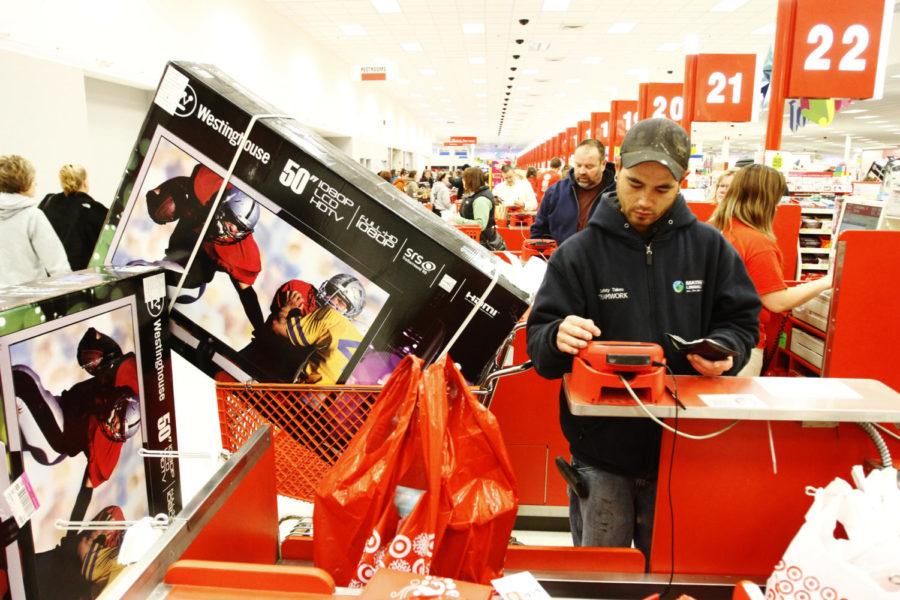 Jimmy Martin, of Polk City, Iowa, gets checked out at Target in Ankeny, Iowa, on Nov. 22. Martin took advantage of Targets new Black Friday strategy of opening the doors at 9 p.m. Thanksgiving day instead of at midnight. He waited only two hours to purchase two 50-inch TVs and was out the door by 9:25 p.m.
