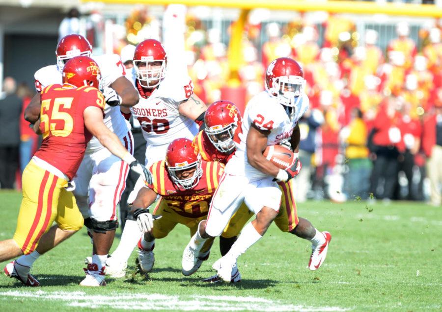 ISU defense attempts to tackle OU running back Brennan Clay in Iowa States 35-20 loss to Oklahoma on Saturday, Nov. 3, 2012 at Jack Trice Stadium.
