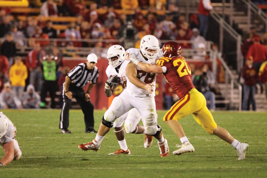 Linebacker Jake Knott tries to get around a Texas blocker during
the game against the Longhorns on Oct. 1. Knott had a total of 8
tackles throughout the game and Iowa State lost to Texas with a
final score of 37-14.
