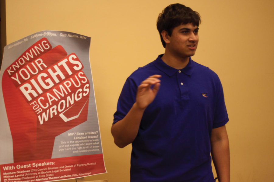 Abhishek Seshappa, junior in mechanical engineering, greets people as they enter the Sun Room for the Know Your Rights for Campus Wrongs discussion. A panel made up of city council member Matthew Goodman, attorney Matt Lindholm, student legal services representative Michael Levine, and ISU lecturer Mike Bootsma discussed a wide variety of student and community legal issues on Wednesday, Nov. 7, in the Sun Room of the Memorial Union. 

