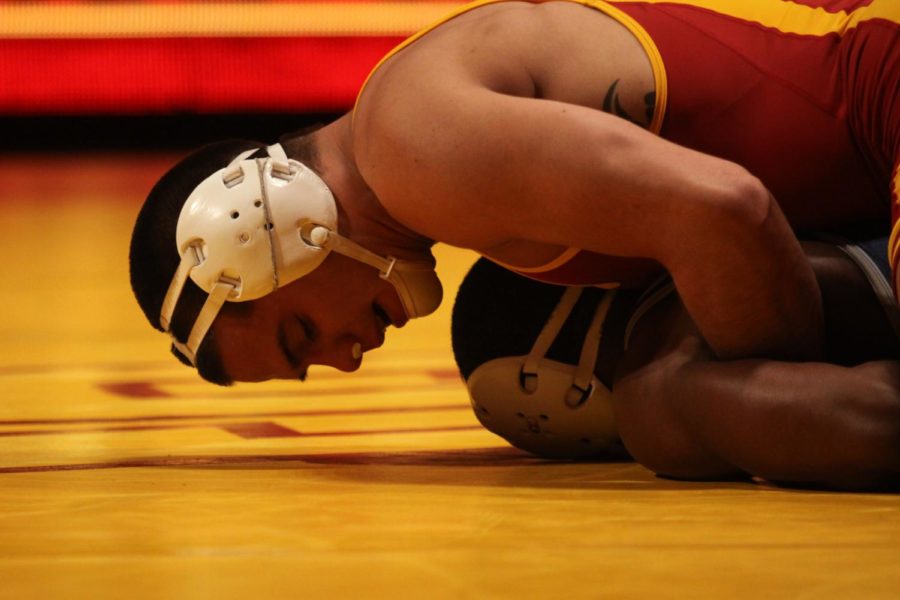 Redshirt sophomore Michael Moreno pins Old Dominions Tristan Warner to the mat in his match at Hilton Coliseum on Nov. 25. The Cyclones lost 22-13.
