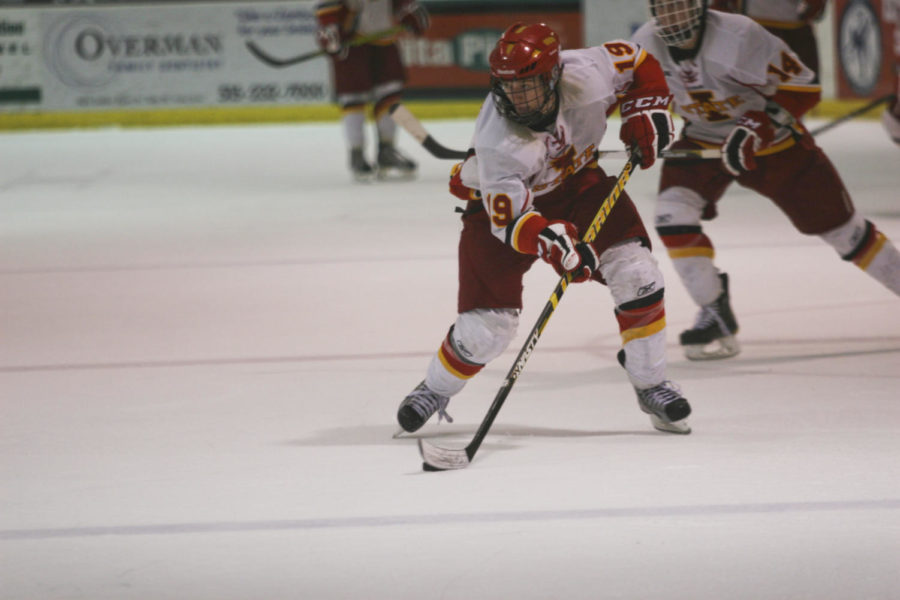 Jonathon Feavel brings up the puck on Nov. 10, 2012 at the Ames Ice Arena in their second game against the University of Oklahoma Sooners. Iowa State lost 3-1.
